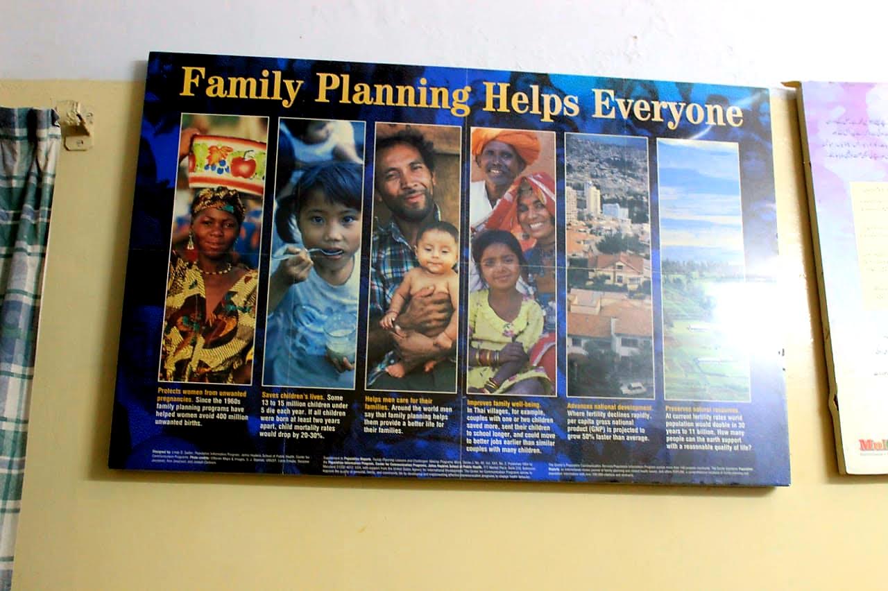 A Poster at the Hospital explains the benefits of Family Planning and shows healthy children.