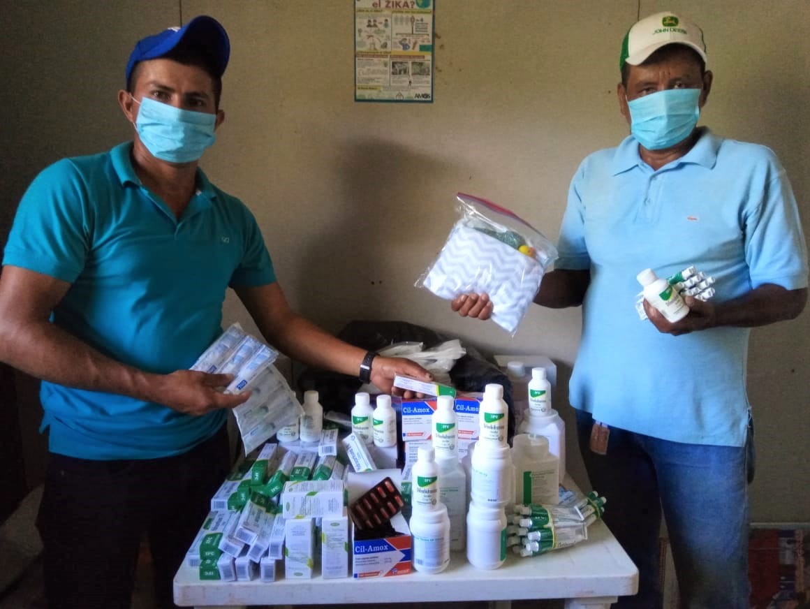 Health Promoters in Sabalete, Nicaragua display medicine, cleaning supplies, and personal protective equipment.