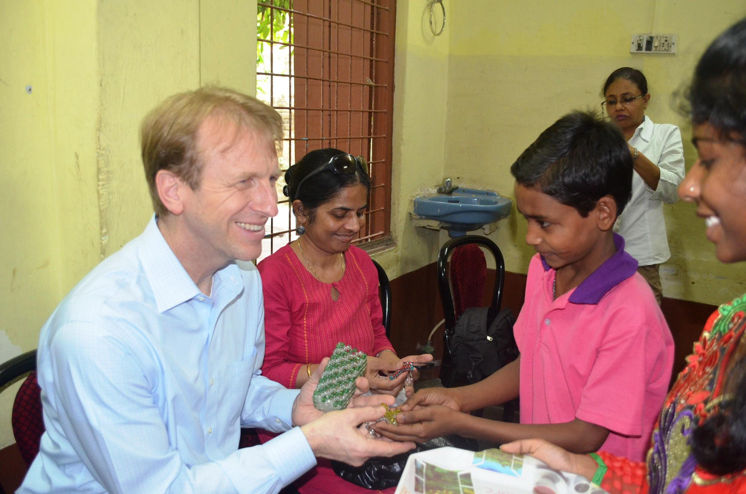 Daniel Speckhard, President & CEO of Lutheran World Relief and IMA World Health, with children at the Arunima Hospice, a care facility for people with HIV/AIDs and children whose parents have HIV/AIDs that is affiliated with the Episcopal Diocese of Kolkota, India.