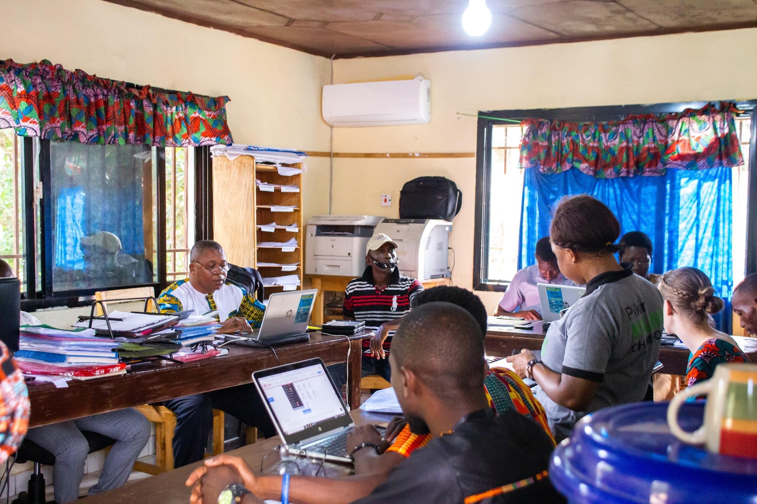 People sit a computers to review health data