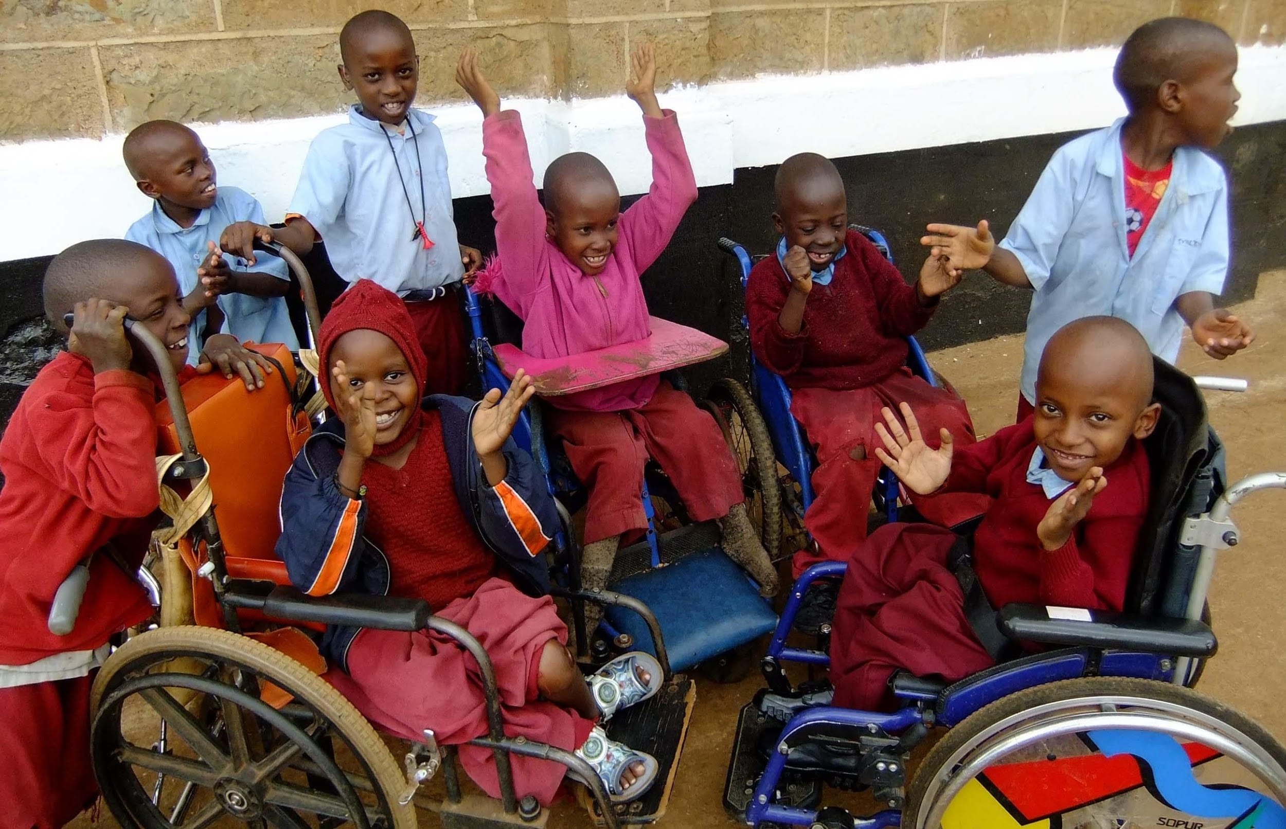 Happy children in wheelchairs