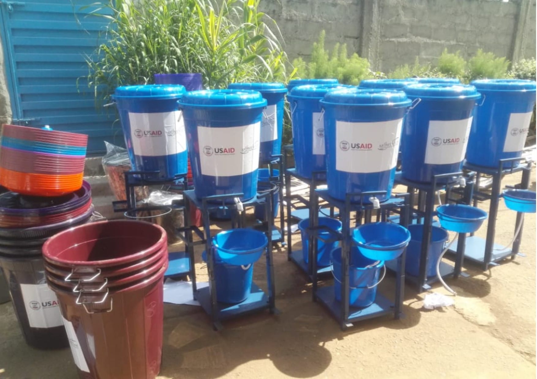 Blue Water containers for sanitization sit ready to be distributed throughout Sierra Leone.