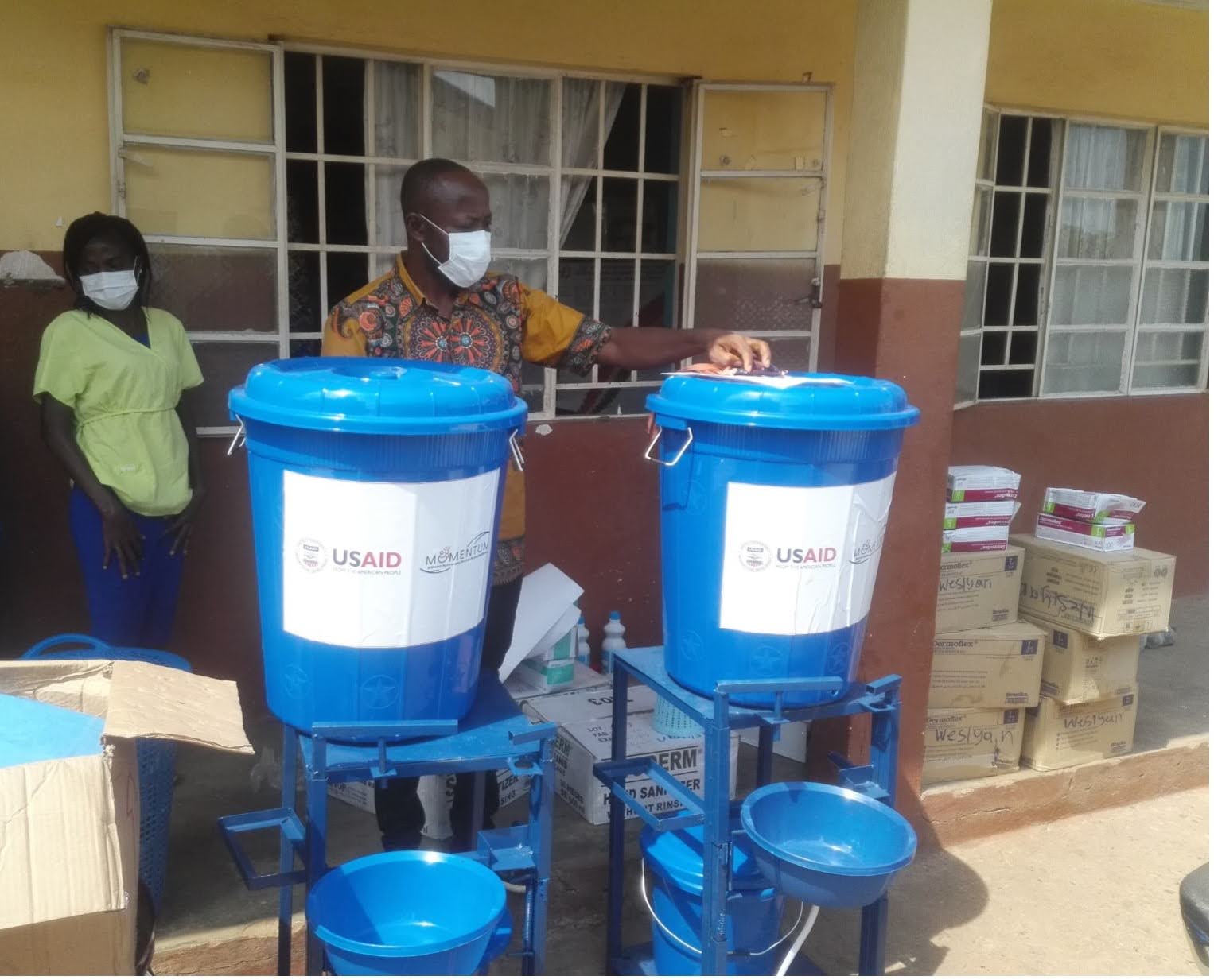 Health workers with water purification systems in Sierre Leone