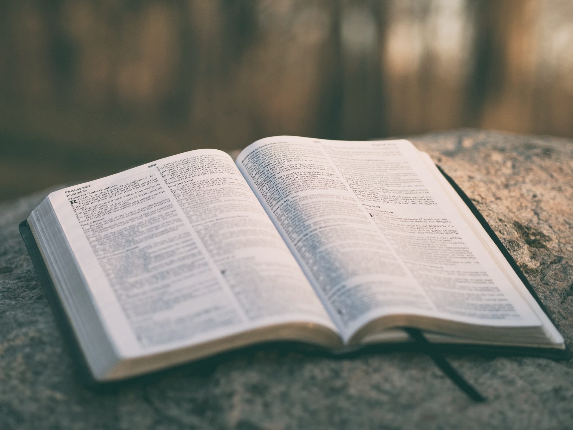 A bible sits on a table.