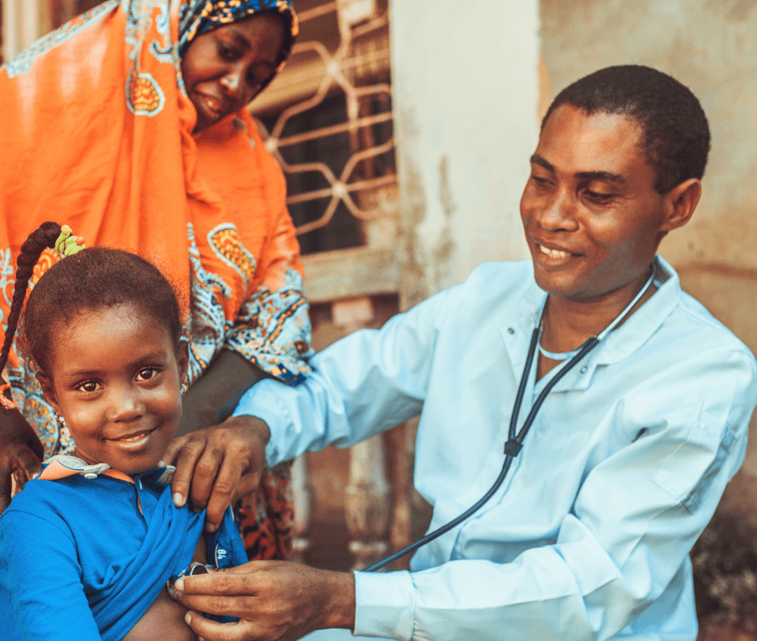 Doctor uses stethoscope to example girl